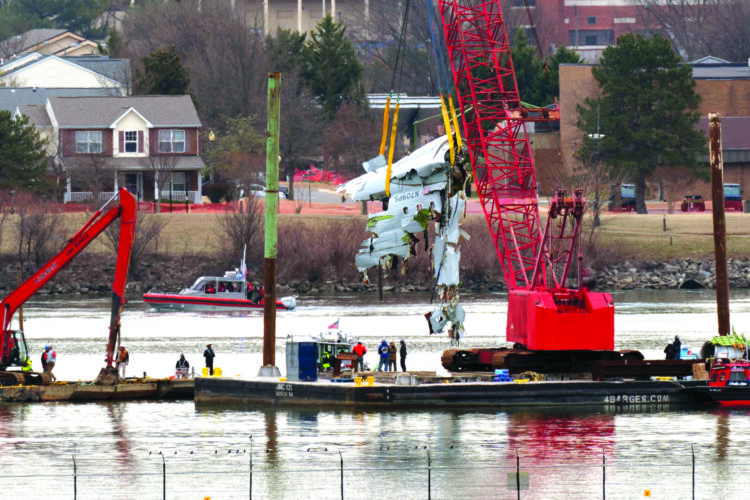 Salvage crews recover engine and large portion of jet from river after ...